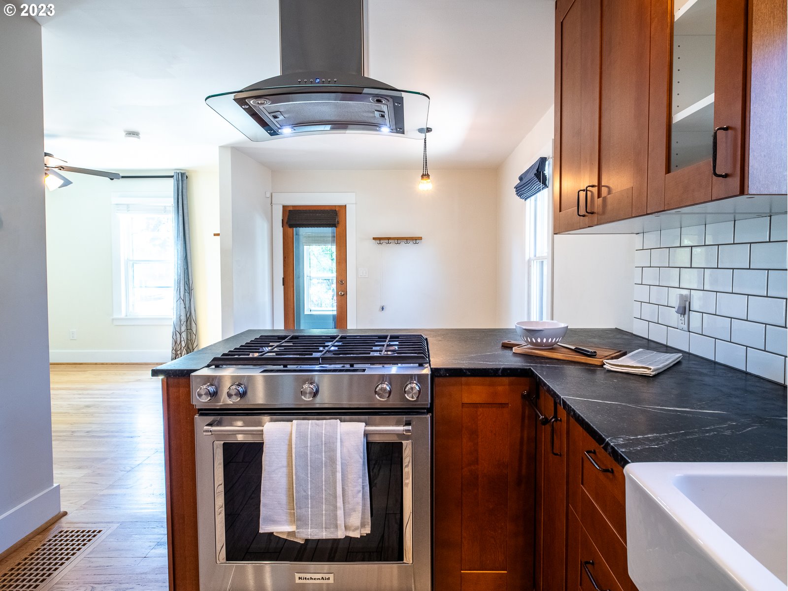 903 North Winchell Street Portland, OR 97217 - Photo 13 of 34 a kitchen with stainless steel appliances granite countertop a stove and a sink