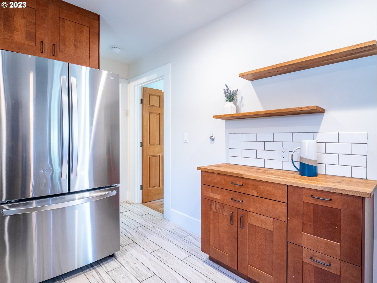 903 North Winchell Street Portland, OR 97217 - Photo 14 of 34 a kitchen with stainless steel appliances a refrigerator and a stove