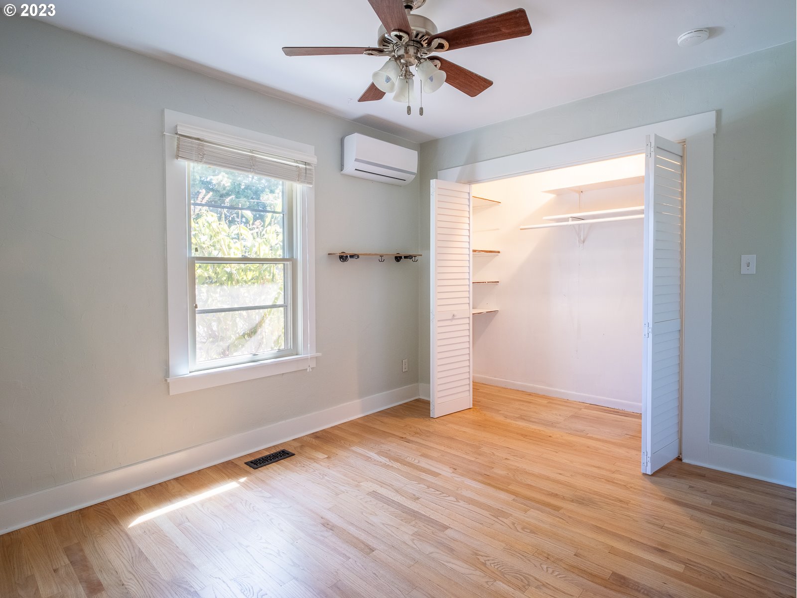 903 North Winchell Street Portland, OR 97217 - Photo 15 of 34 a view of an empty room with wooden floor and a window