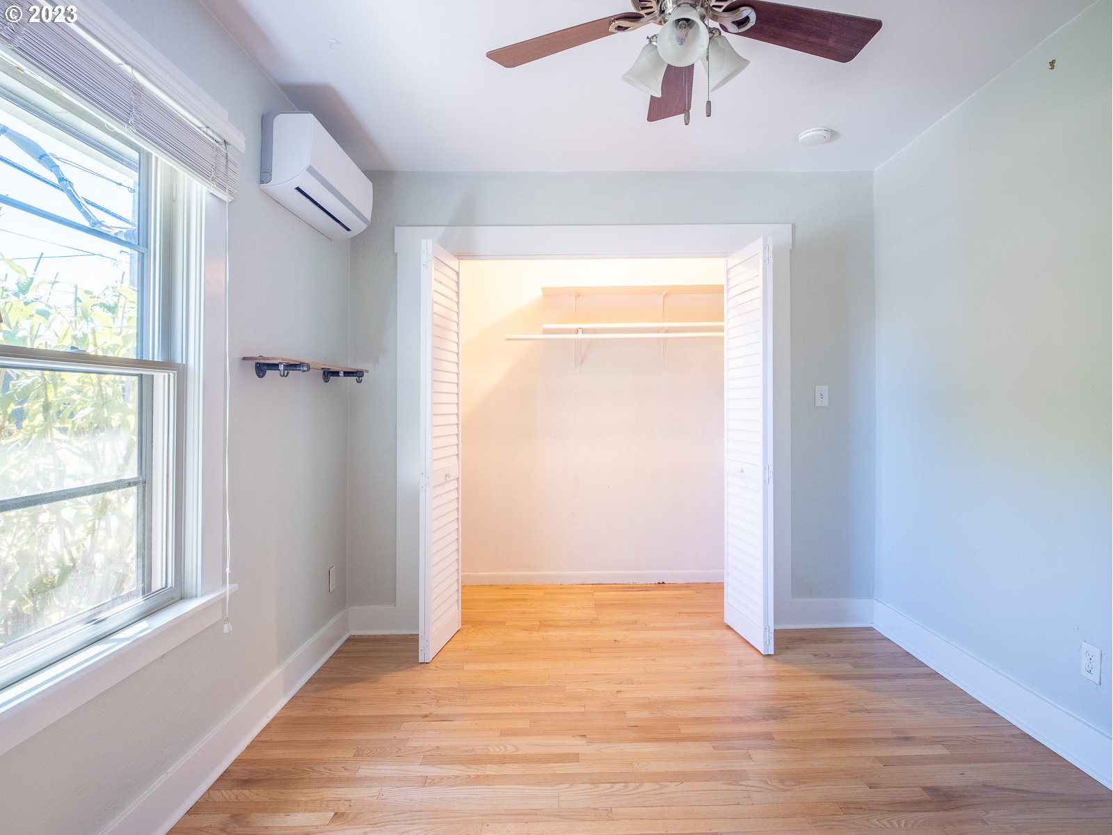 903 North Winchell Street Portland, OR 97217 - Photo 17 of 34 a view of an empty room with wooden floor and a window