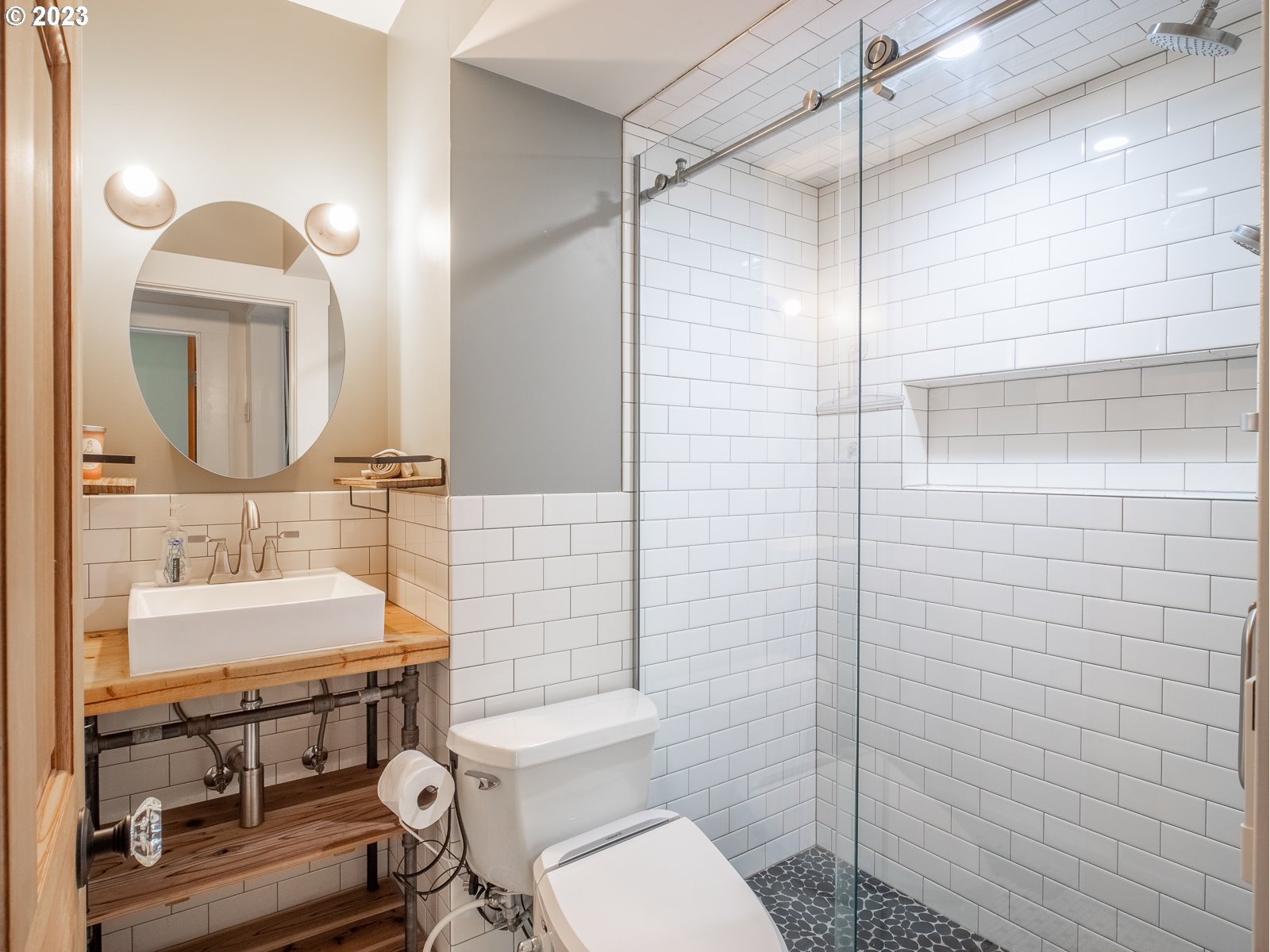 903 North Winchell Street Portland, OR 97217 - Photo 19 of 34 a bathroom with a sink toilet and shower