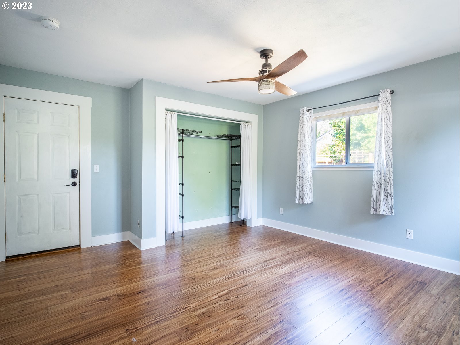 903 North Winchell Street Portland, OR 97217 - Photo 22 of 34 a view of an empty room with wooden floor and a window