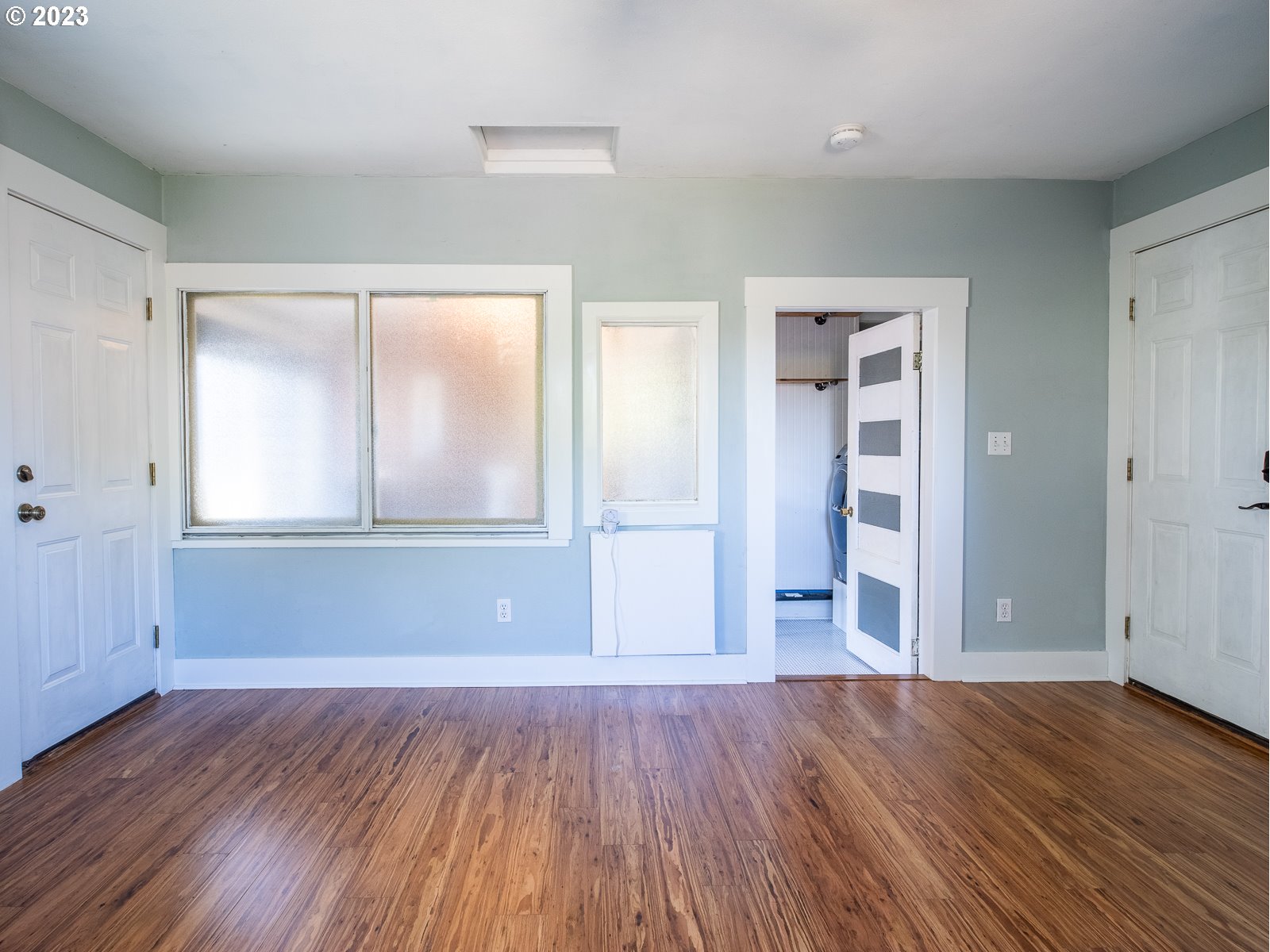 903 North Winchell Street Portland, OR 97217 - Photo 23 of 34 an empty room with wooden floor and windows