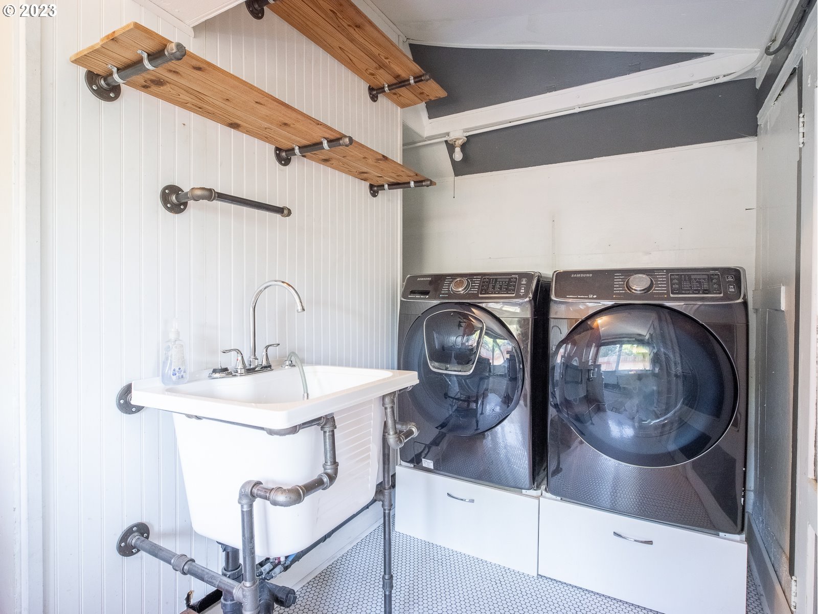 903 North Winchell Street Portland, OR 97217 - Photo 24 of 34 a bathroom with a sink and a mirror