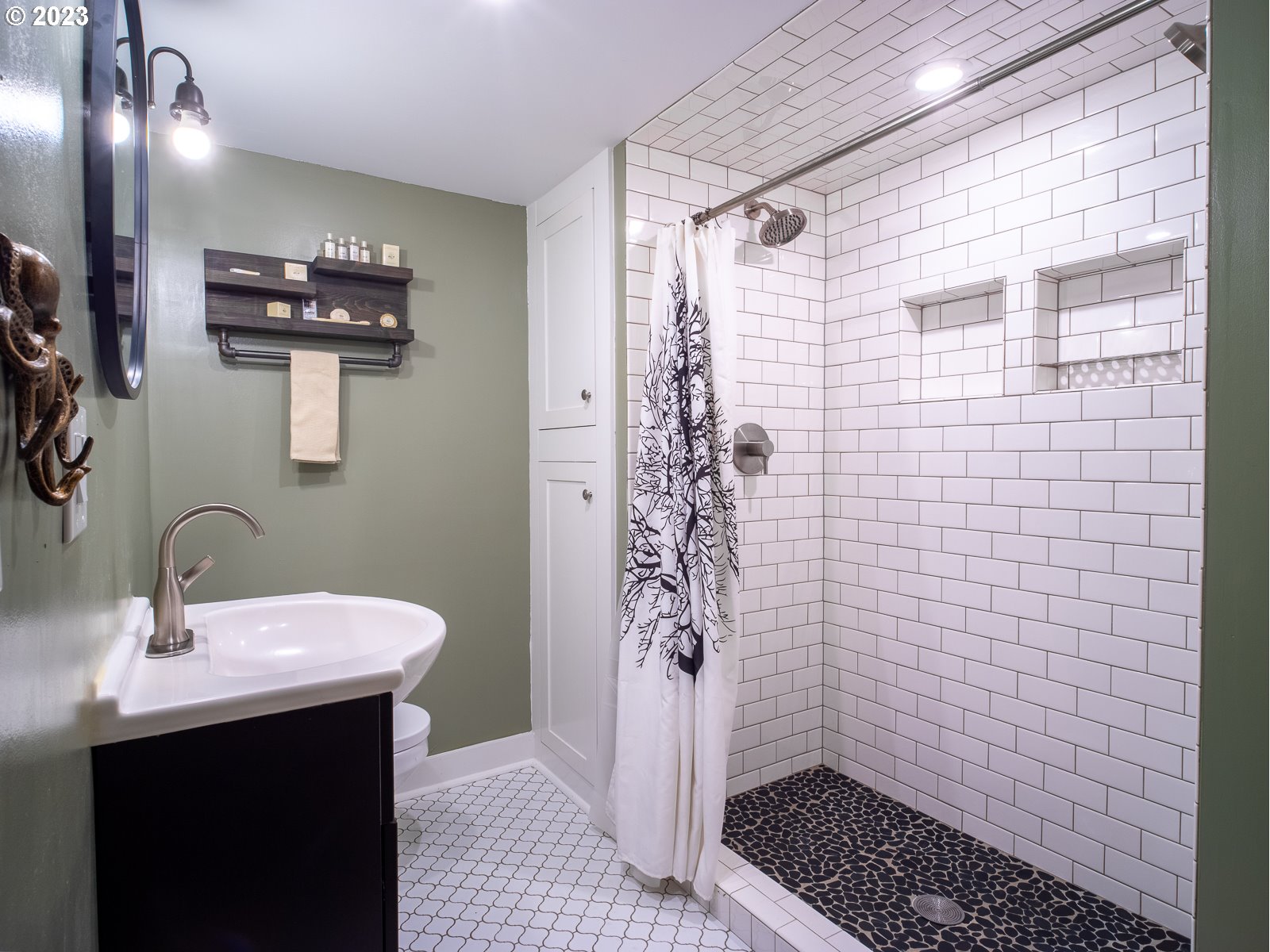 903 North Winchell Street Portland, OR 97217 - Photo 26 of 34 a bathroom with a sink a toilet a shower and a mirror