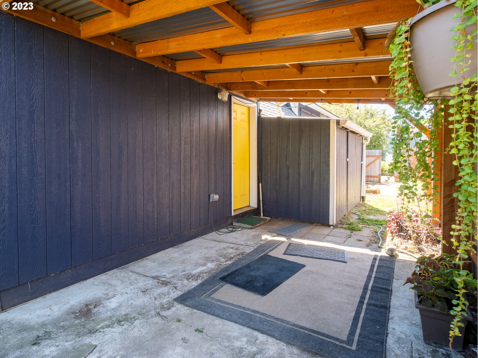 903 North Winchell Street Portland, OR 97217 - Photo 29 of 34 a view of backyard with tub and trees in the background