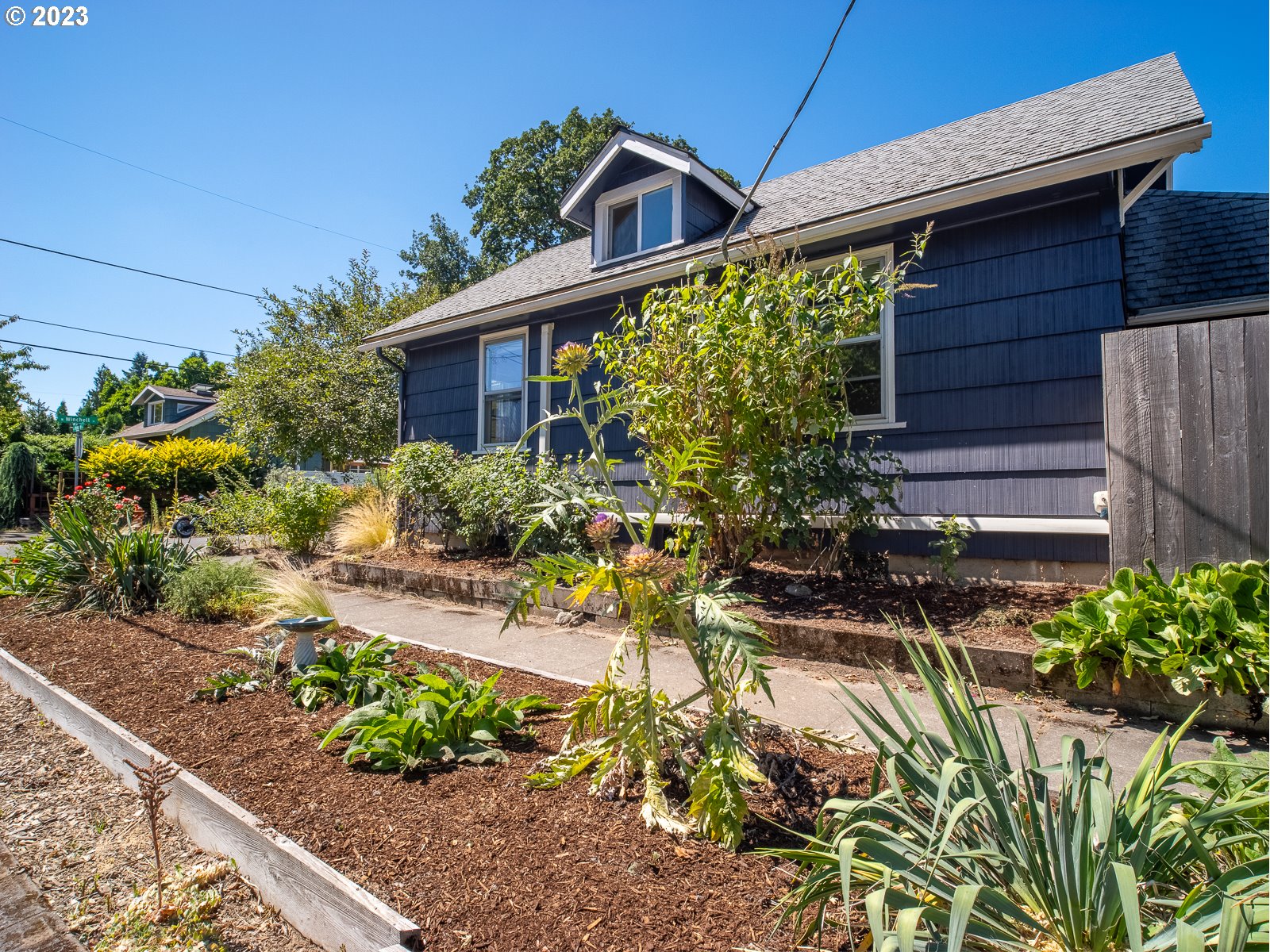 903 North Winchell Street Portland, OR 97217 - Photo 4 of 34 a front view of a house with a yard