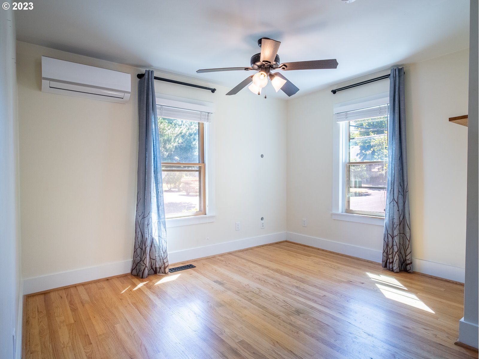 903 North Winchell Street Portland, OR 97217 - Photo 8 of 34 a view of empty room with wooden floor and fan