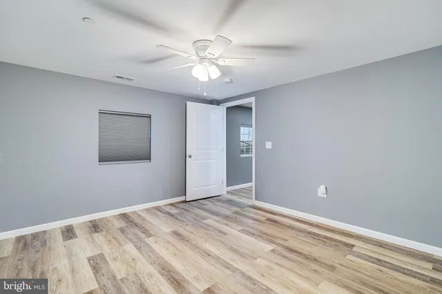 a view of room with window and ceiling fan