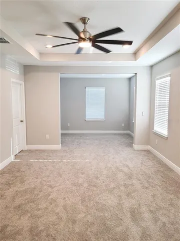 a large spacious bathroom with a large tub shower and sink