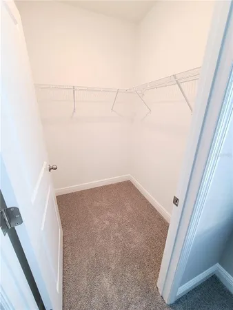 a bathroom with a granite countertop sink a toilet and bathtub