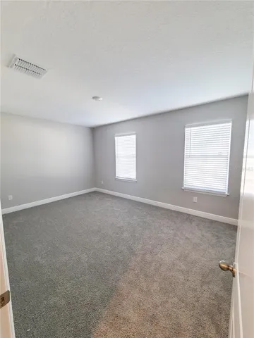 a kitchen with stainless steel appliances granite countertop a stove a microwave and a refrigerator