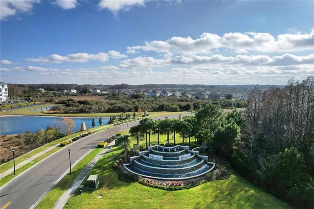 an aerial view of a house with a swimming pool