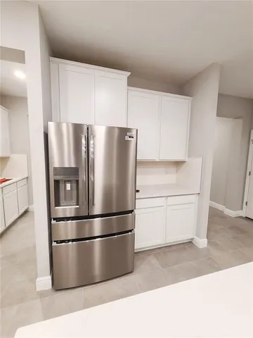 a refrigerator freezer sitting in a kitchen