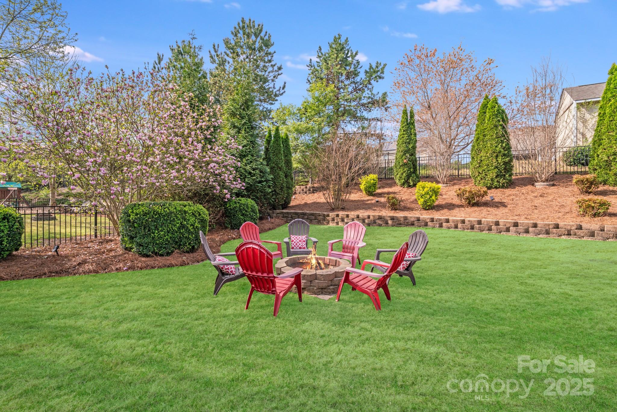 1504 Ridgehaven Road Waxhaw, NC 28173 - Photo 8 of 46 a backyard of a house with table and chairs