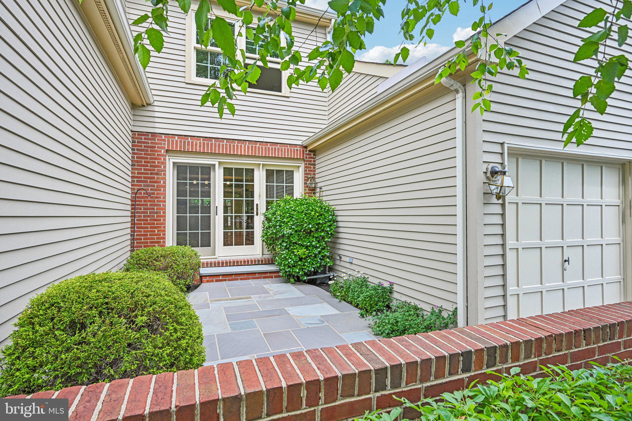 175 Hunter Court Ambler, PA 19002 - Photo 5 of 9 Charming entryway with lush greenery.