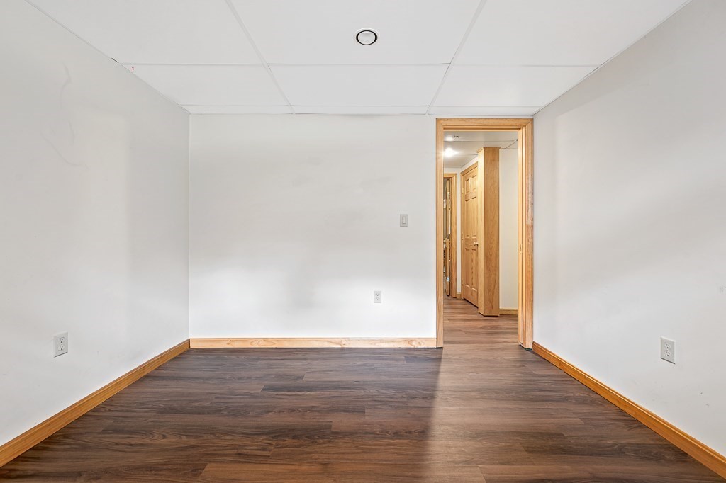 47 Lake Road Brookfield, MA 01506 - Photo 19 of 29 a view of an empty room with wooden floor