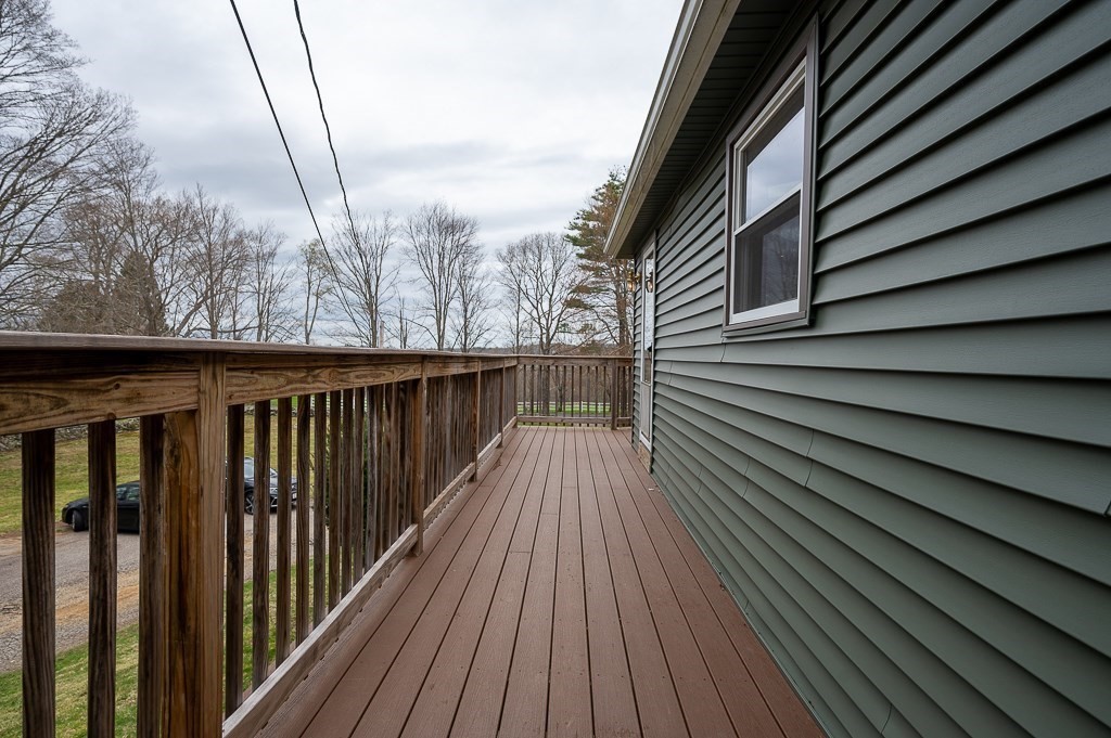 47 Lake Road Brookfield, MA 01506 - Photo 8 of 29 a view of wooden balcony with wooden floor and fence