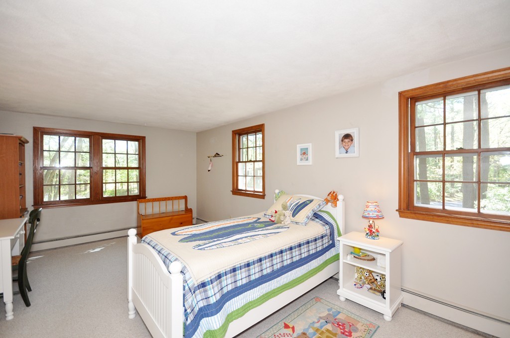 12 Rambling Road Sudbury, MA 01776 - Photo 17 of 26 a bedroom with a bed and a window