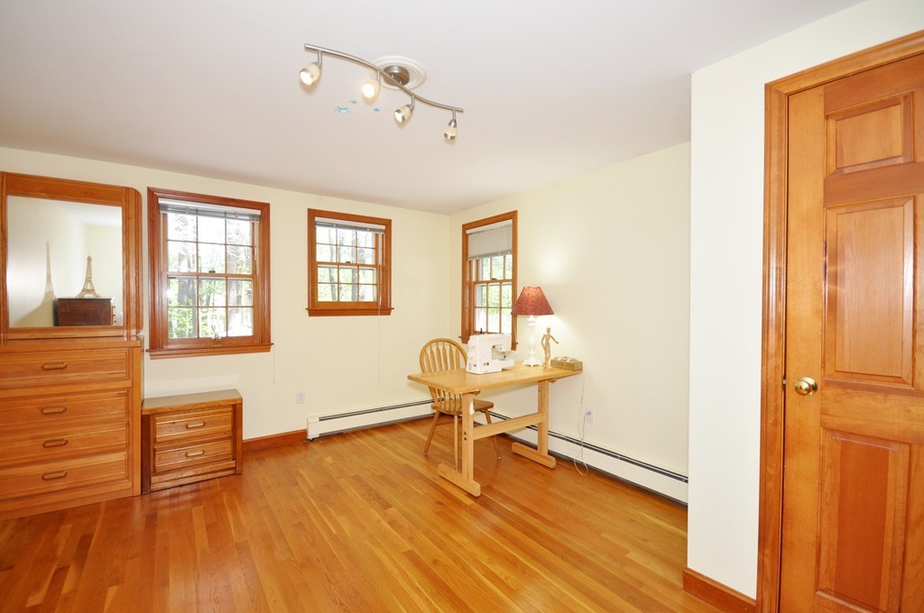 12 Rambling Road Sudbury, MA 01776 - Photo 20 of 26 a view of a livingroom with wooden floor and furniture