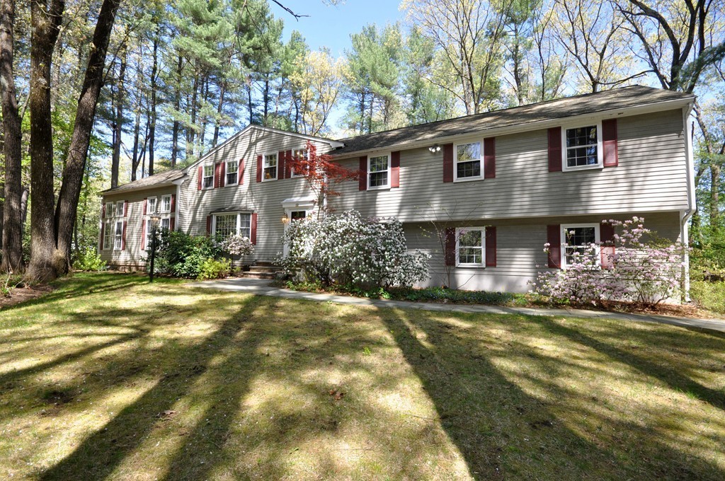 12 Rambling Road Sudbury, MA 01776 - Photo 2 of 26 a front view of a house with a yard