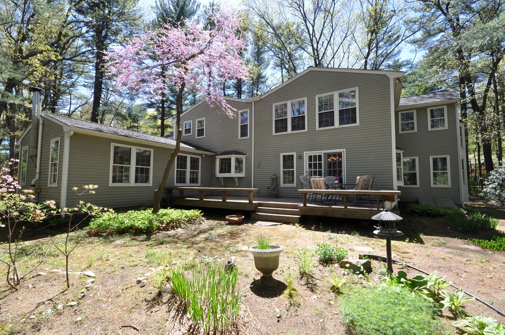 12 Rambling Road Sudbury, MA 01776 - Photo 3 of 26 a front view of a house with a yard