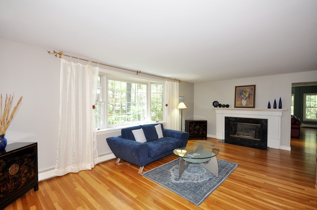 12 Rambling Road Sudbury, MA 01776 - Photo 4 of 26 a living room with furniture and a fireplace