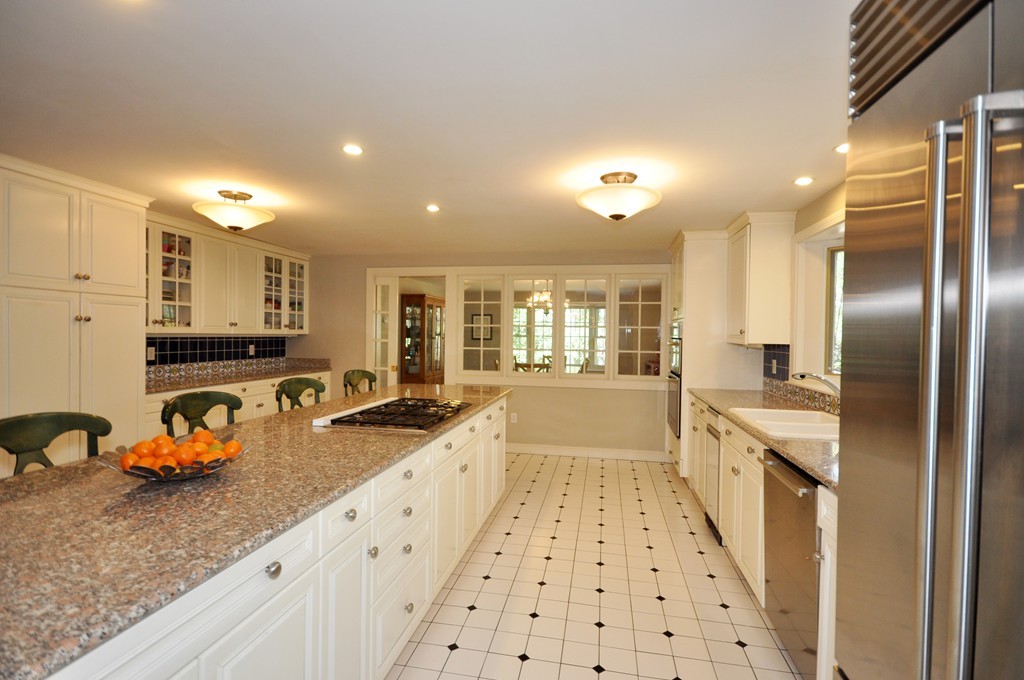 12 Rambling Road Sudbury, MA 01776 - Photo 10 of 26 a large white kitchen with a large window
