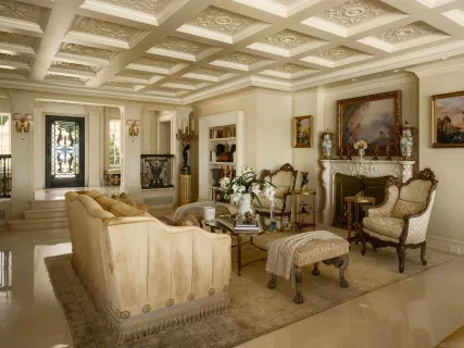 a living room with furniture and a mirror