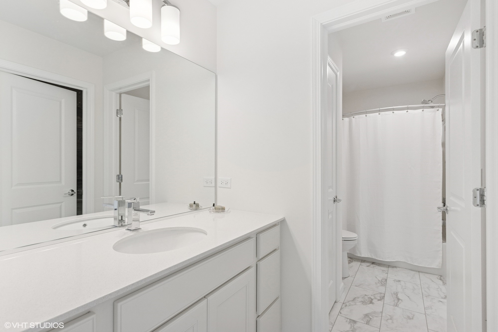12906 South Sydney Circle Plainfield, IL 60585 - Photo 19 of 31 a bathroom with a sink double vanity and a mirror