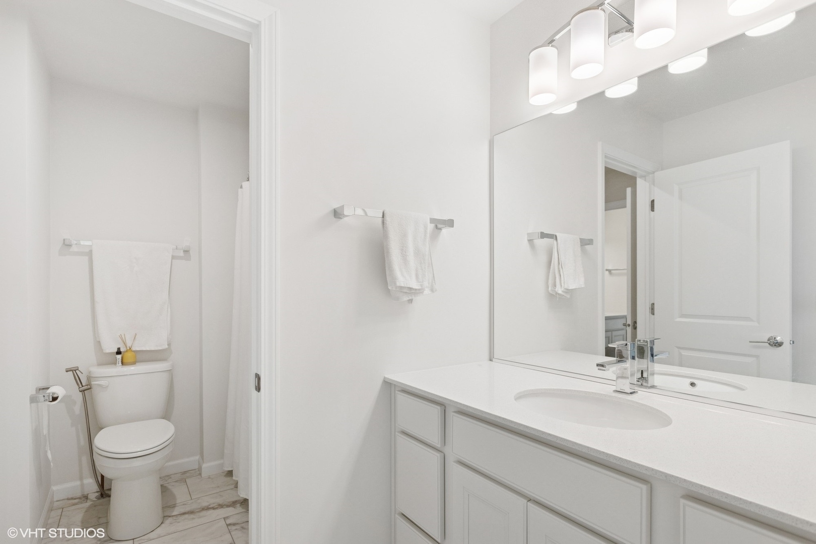 12906 South Sydney Circle Plainfield, IL 60585 - Photo 20 of 31 a bathroom with a sink a toilet and a mirror