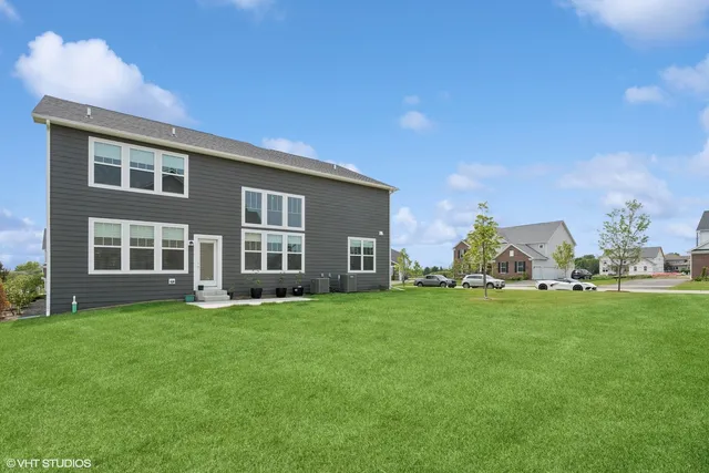 a view of a house with a big yard