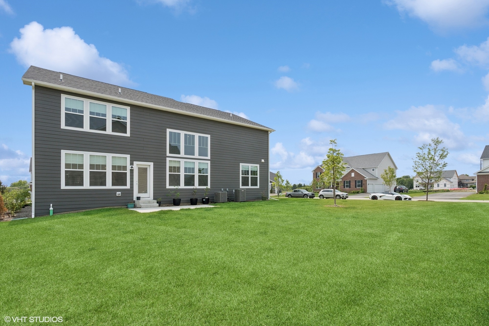 12906 South Sydney Circle Plainfield, IL 60585 - Photo 25 of 31 a view of a house with a yard and many windows