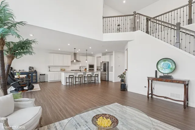 a living room with furniture and kitchen view