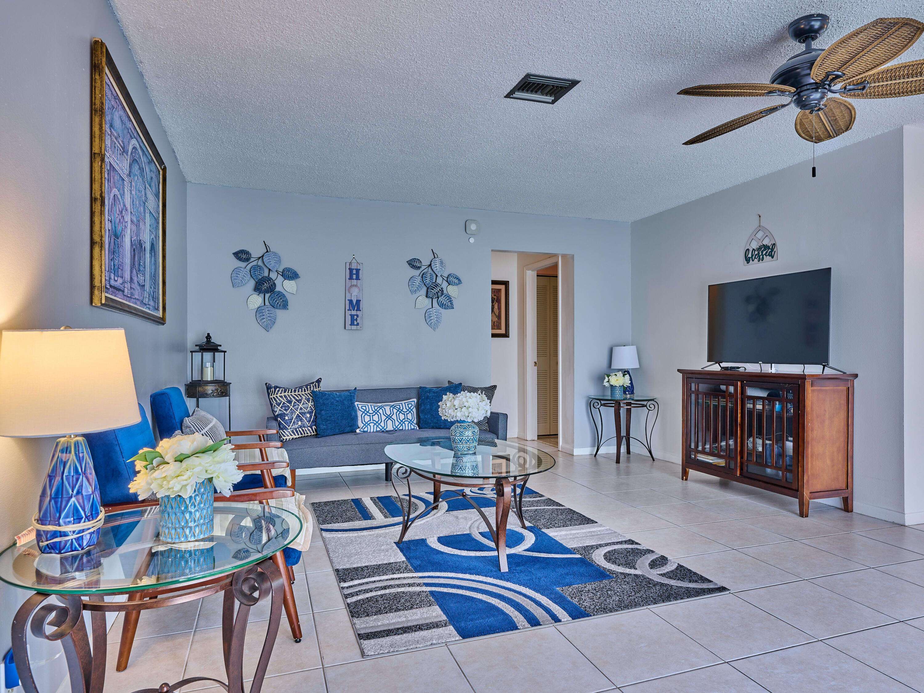 5197 Minto Road Boynton Beach, FL 33472 - Photo 8 of 32 a living room with furniture a rug and a flat screen tv