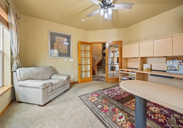 a living room with furniture and a rug