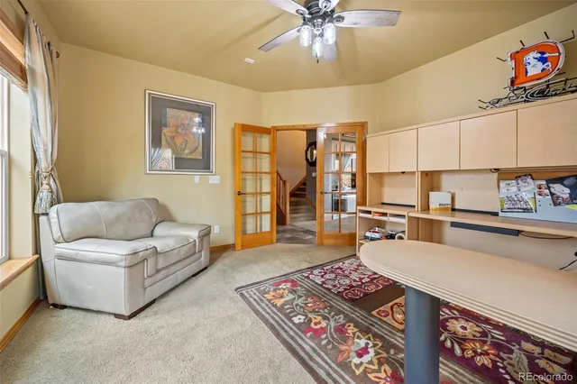 a living room with furniture and a rug