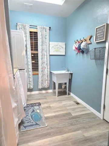 a view of living room with furniture and a window