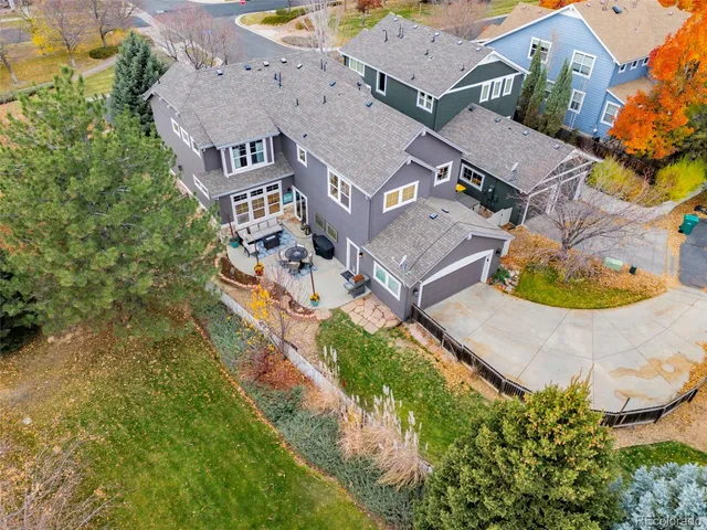 an aerial view of residential houses with outdoor space