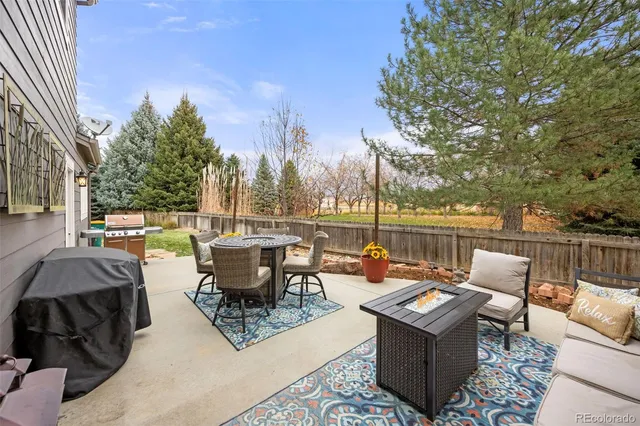 a view of a patio with couches and chairs