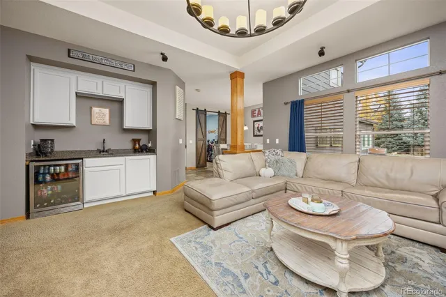 a living room with furniture and a table