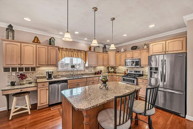 a bedroom with a bed gym equipment and a chandelier