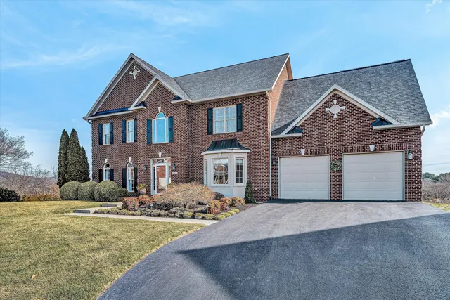 a view of entryway livingroom and hall with wooden floor