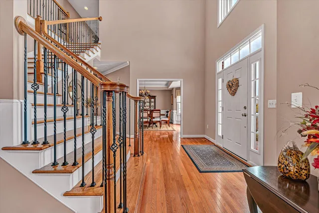 a living room with furniture a lamp and a chandelier