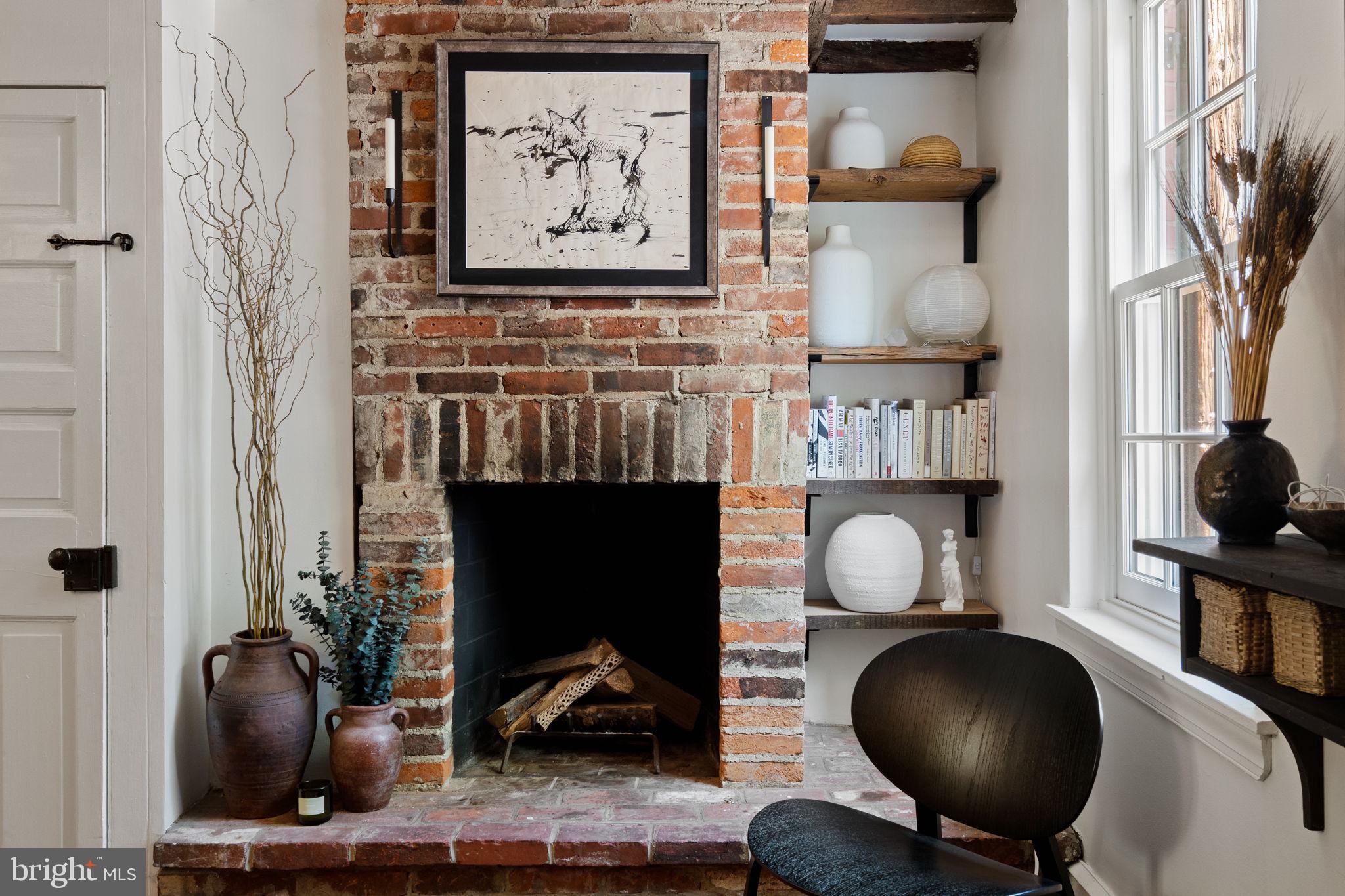 142 Carpenter Street Philadelphia, PA 19147 - Photo 8 of 49 a living room with furniture and a fireplace