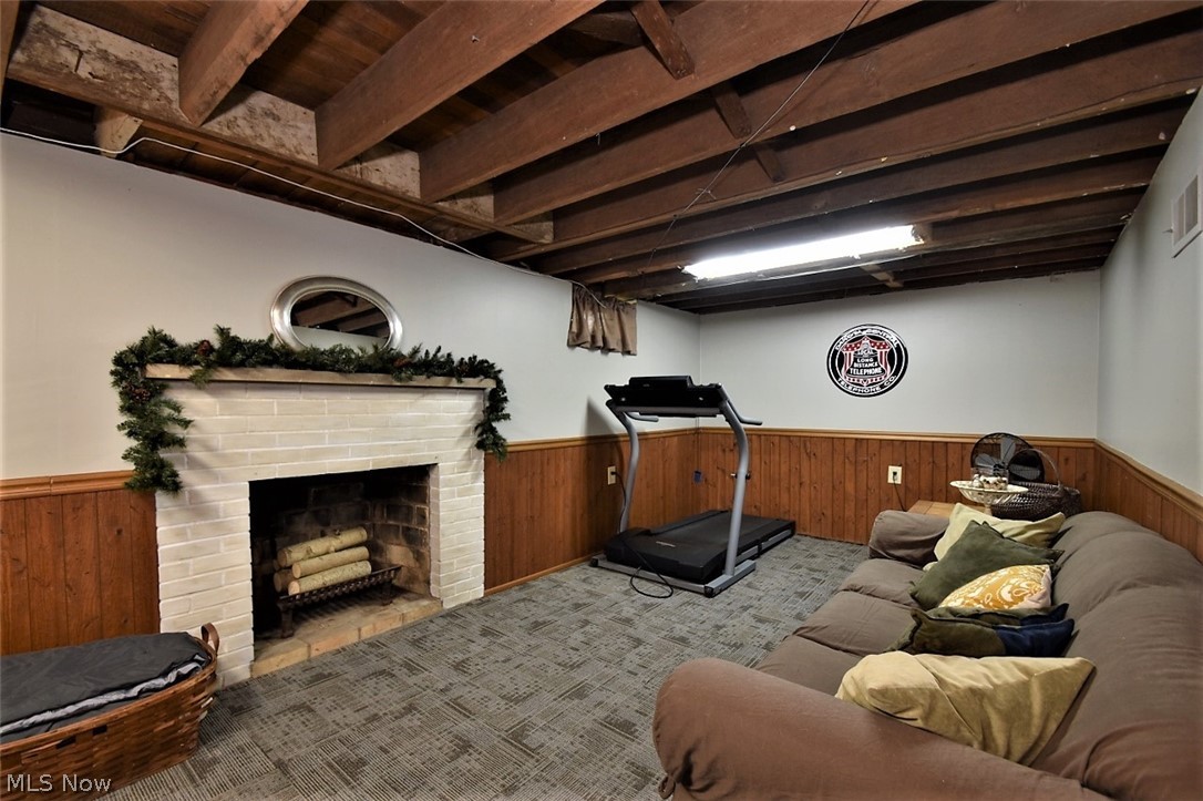 34275 Bainbridge Road Solon, OH 44139 - Photo 26 of 32 Partially finished basement with fireplace and new carpet tiles