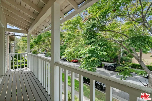 a view of a porch with wooden floor