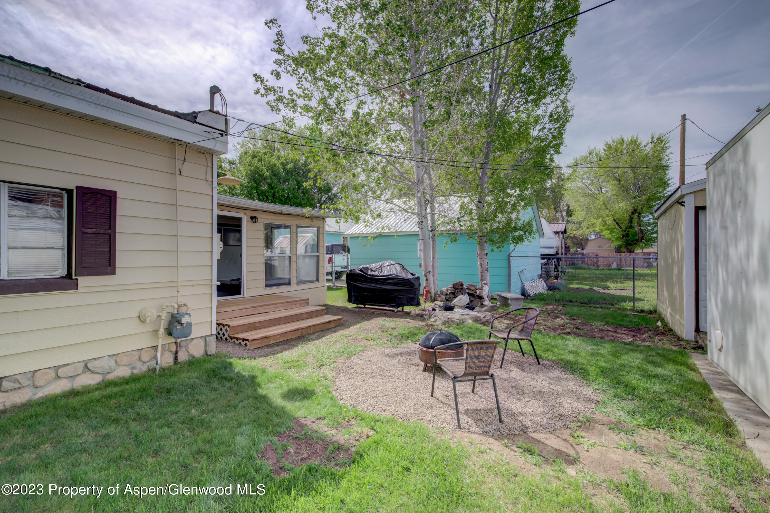 690 Pershing Street Craig, CO 81625 - Photo 19 of 72 a view of a house with backyard and sitting area