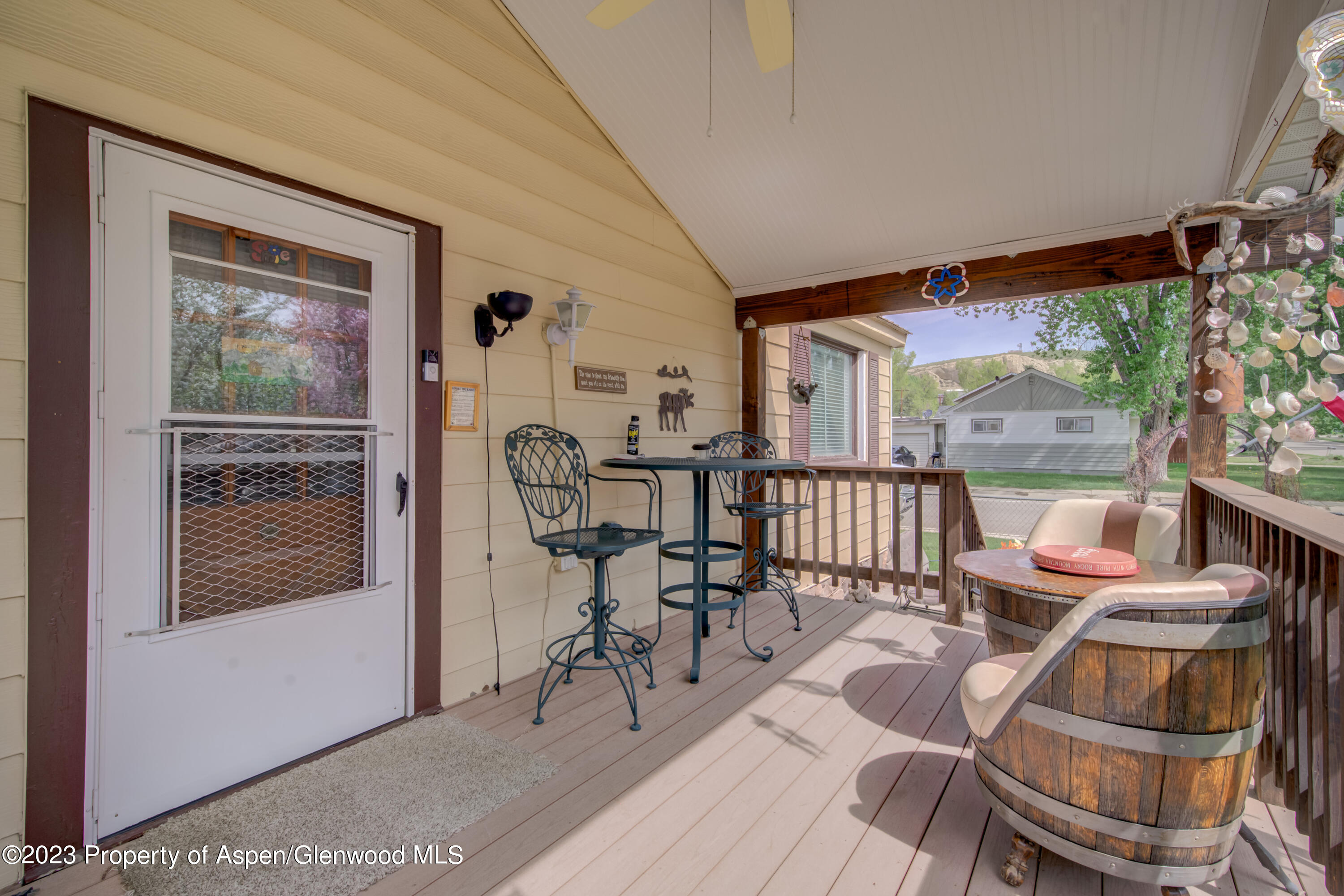 690 Pershing Street Craig, CO 81625 - Photo 22 of 72 a living room with furniture and a floor to ceiling window