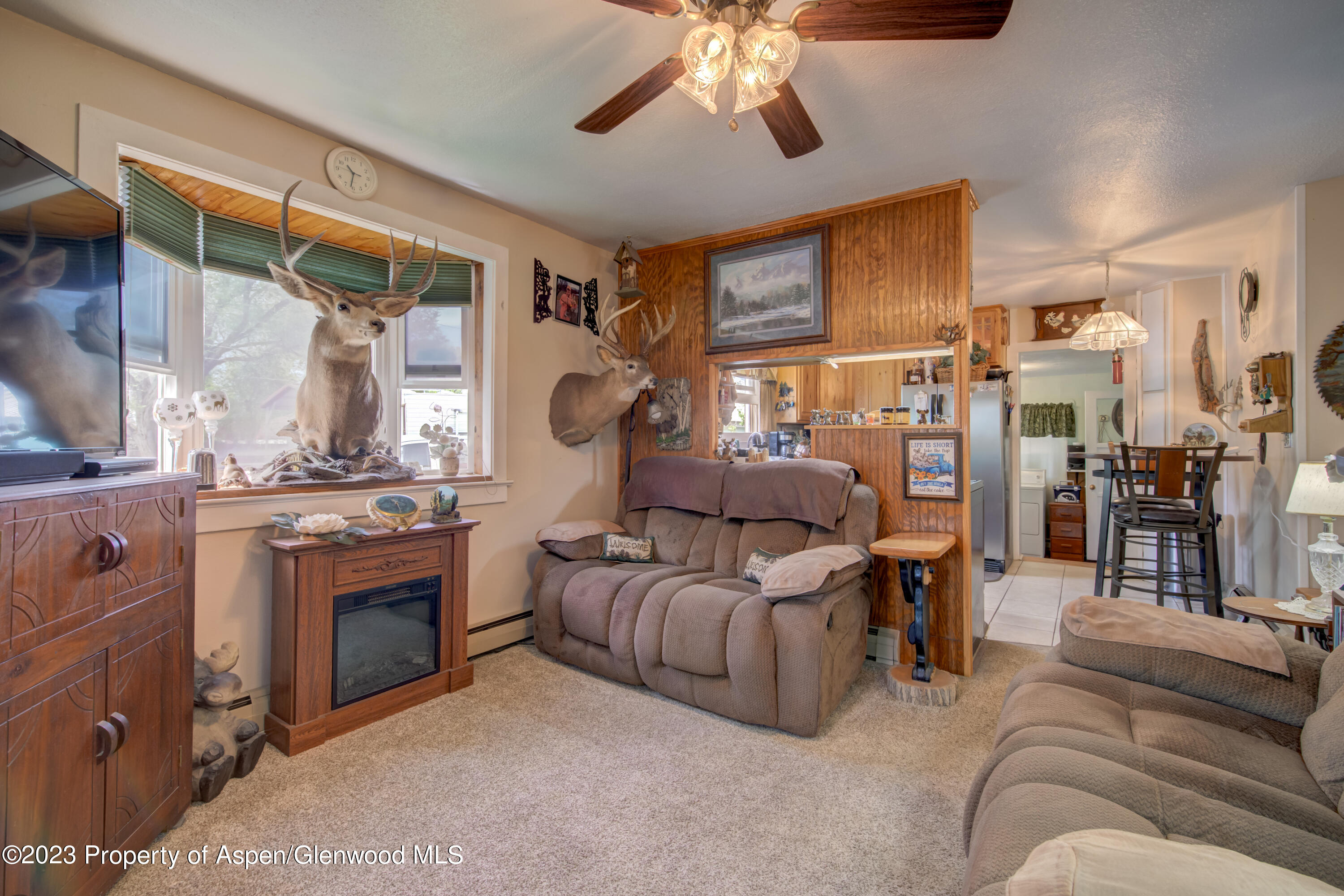 690 Pershing Street Craig, CO 81625 - Photo 25 of 72 a living room with furniture and a fireplace
